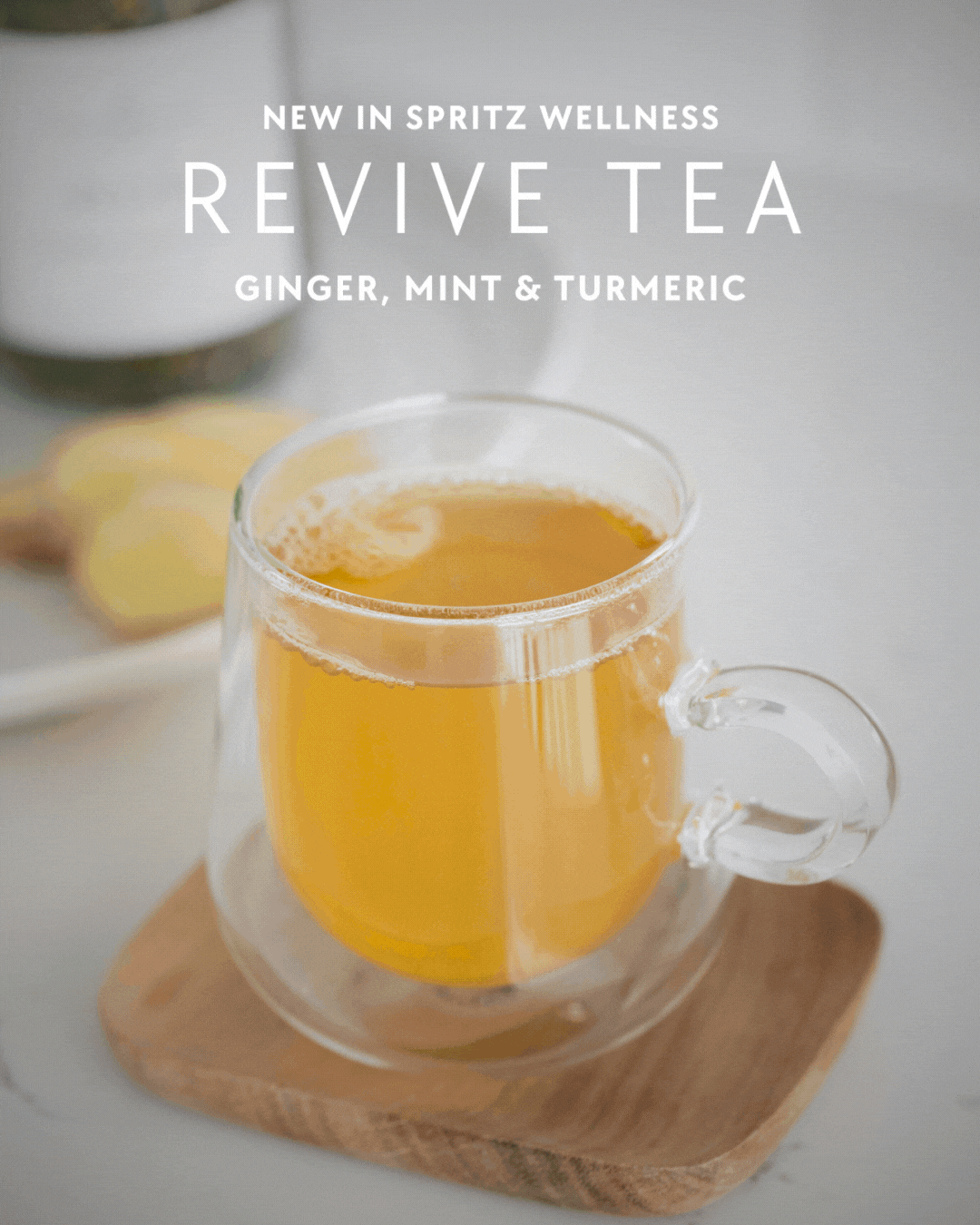 A slideshow of a glass cup of golden Revive Tea, a blend of ginger, mint, and turmeric from Spritz Wellness."
