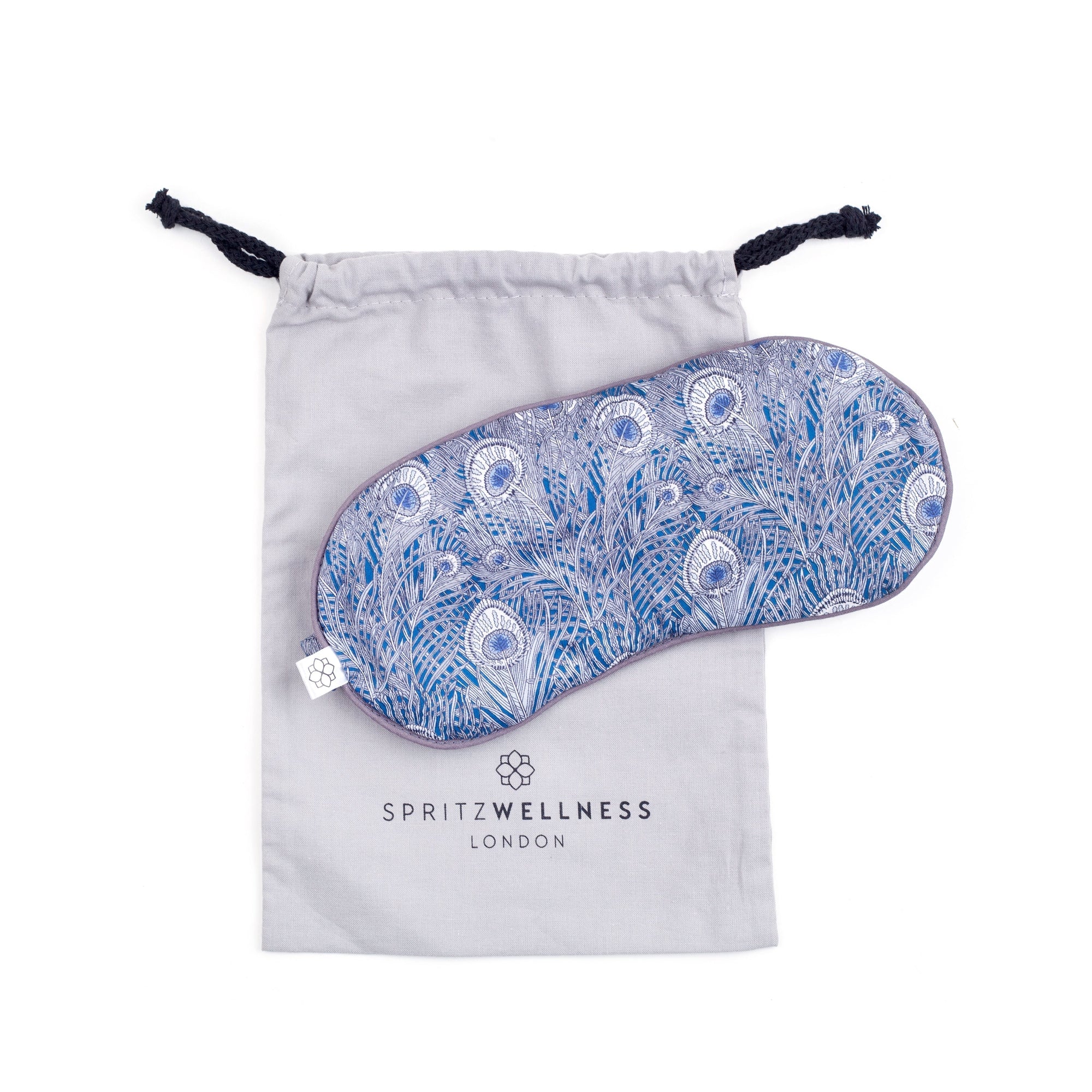 Spritz Wellness Hera Blue eye mask alongside Optibac probiotics for travel