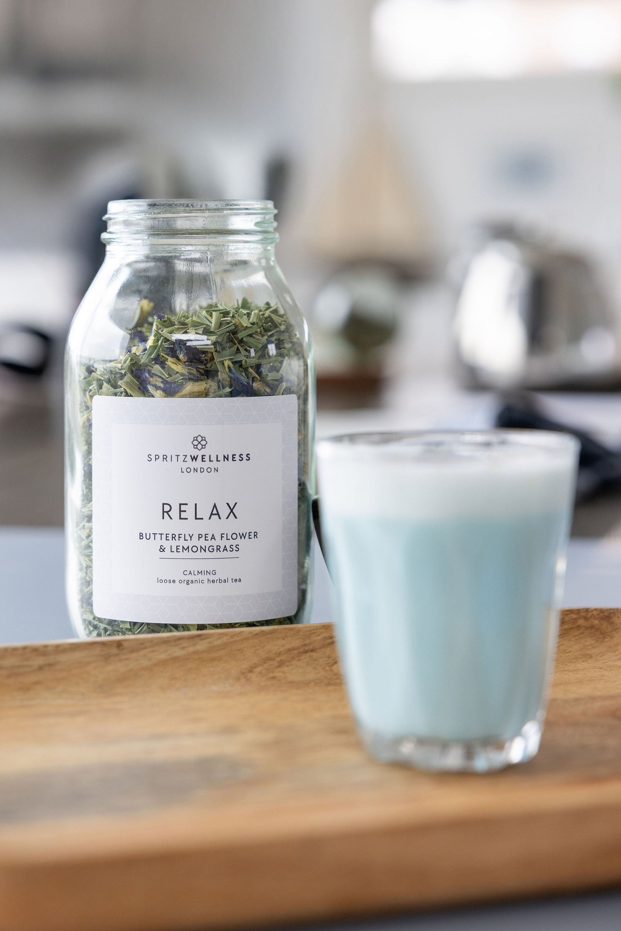 Butterfly pea flower latte made with Spritz Wellness tea