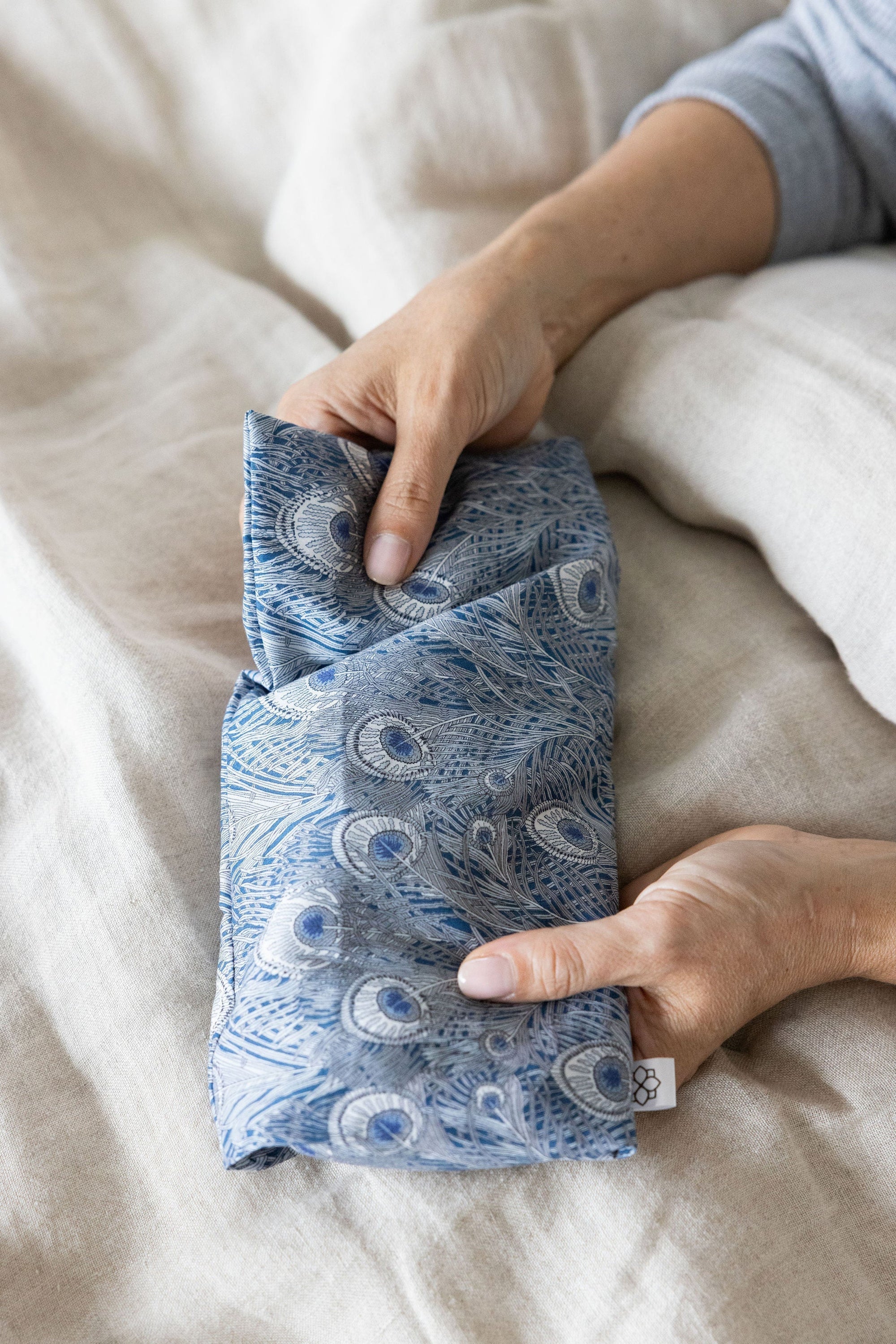 Spritz Wellness eye pillow used as a cooling compress