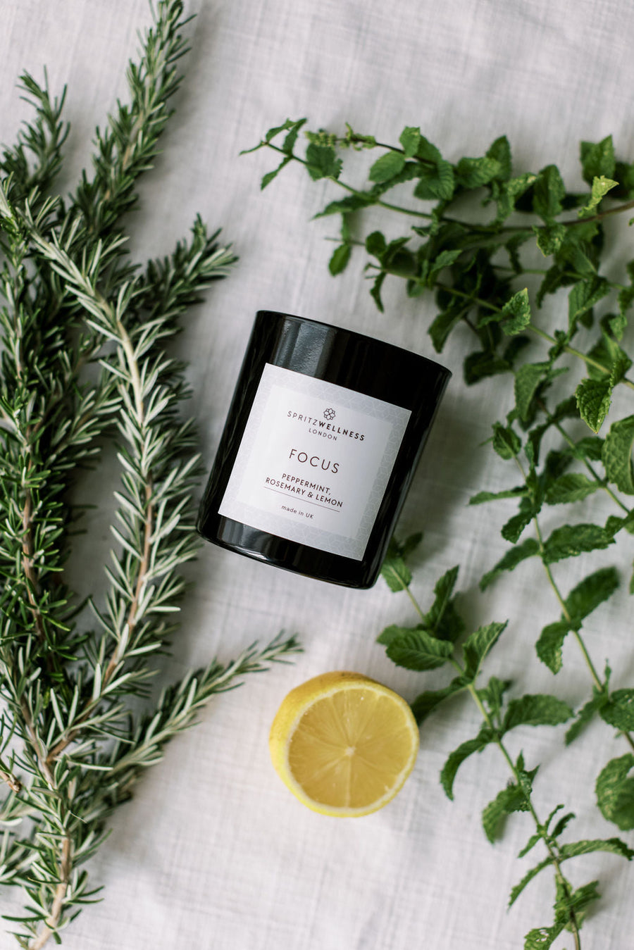 Spritz Wellness Focus candle on a work desk