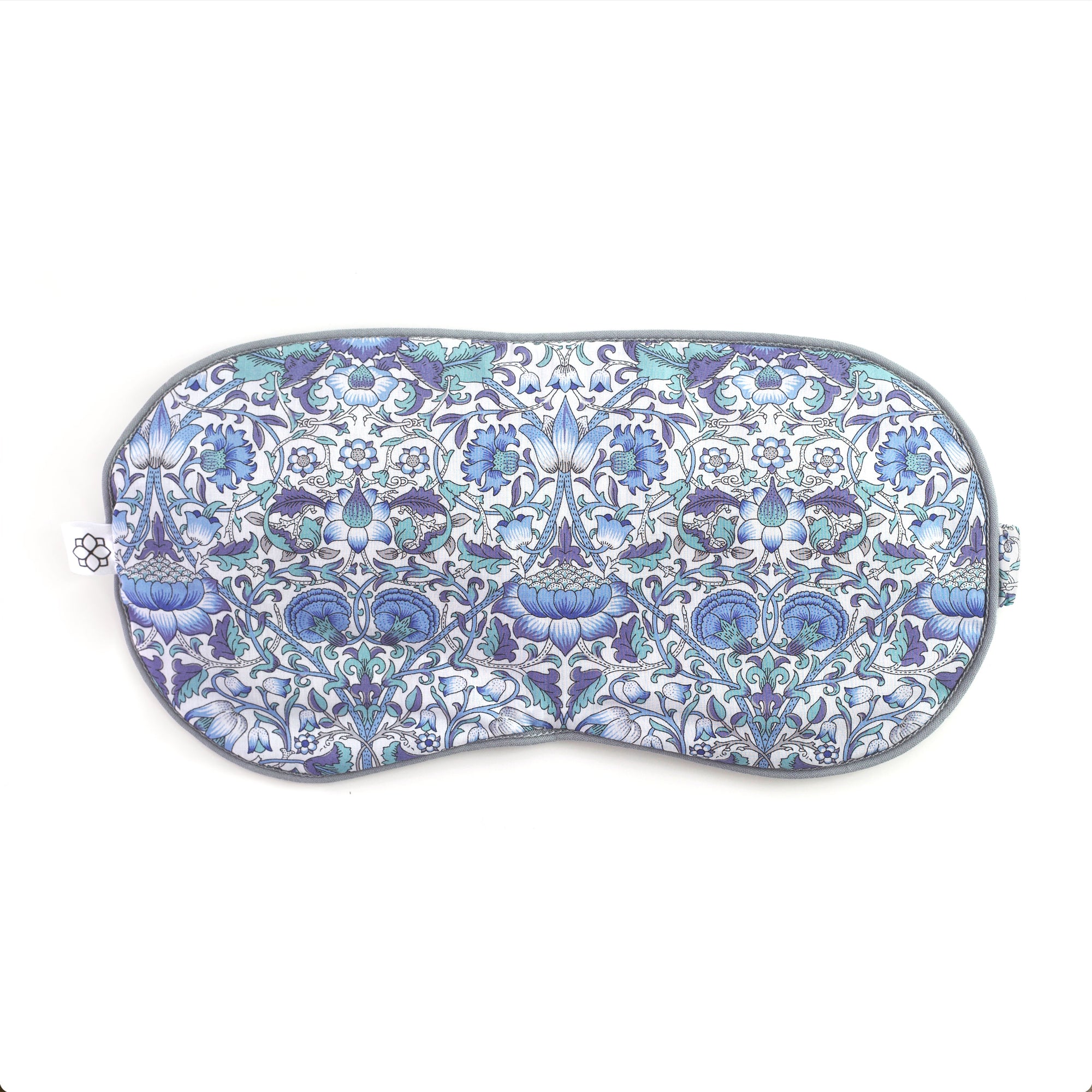 Decorative eye mask with blue and white floral pattern on a white background from Spritz Wellness