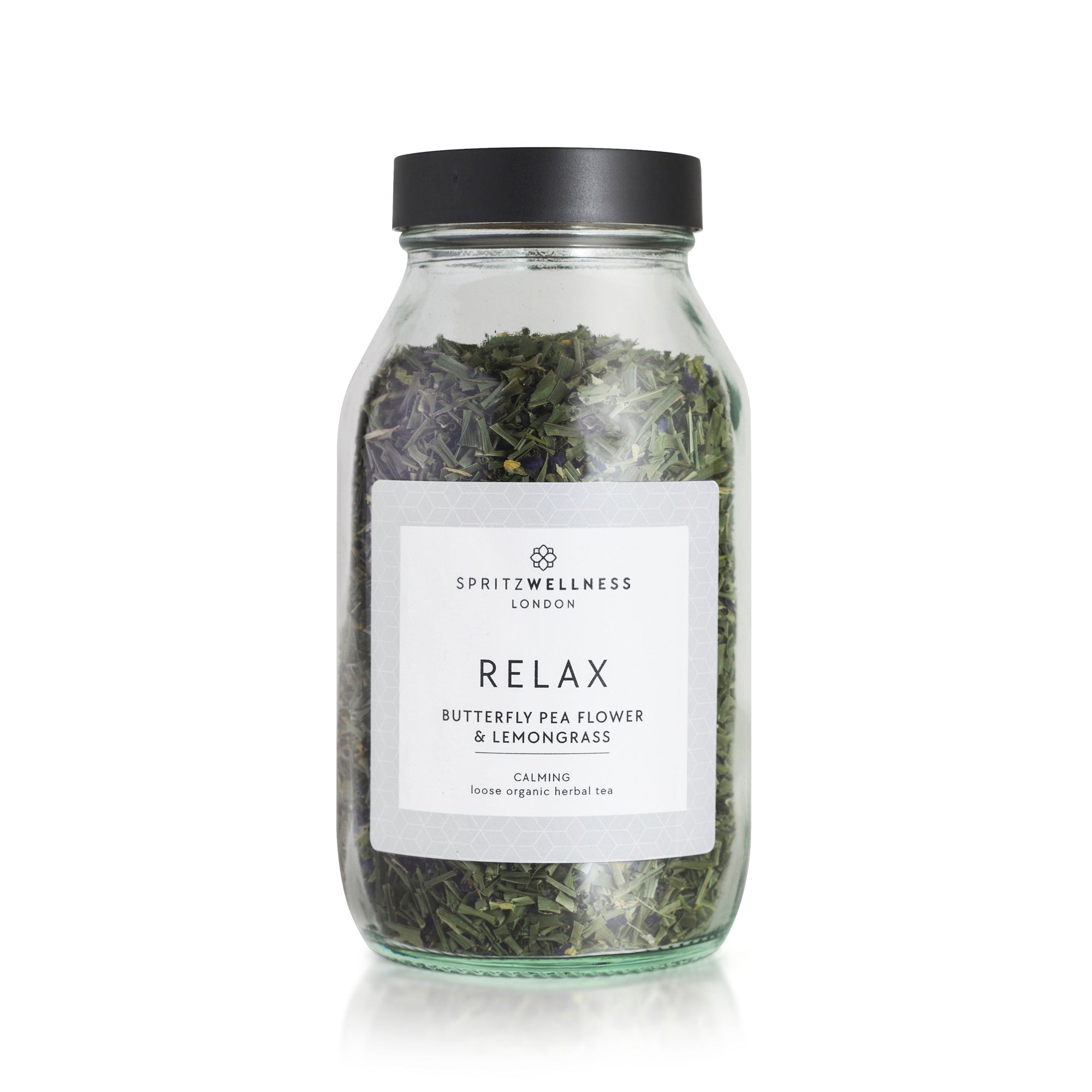 Glass jar of herbal tea labeled 'Relax' by SpritzWellness London on a white background