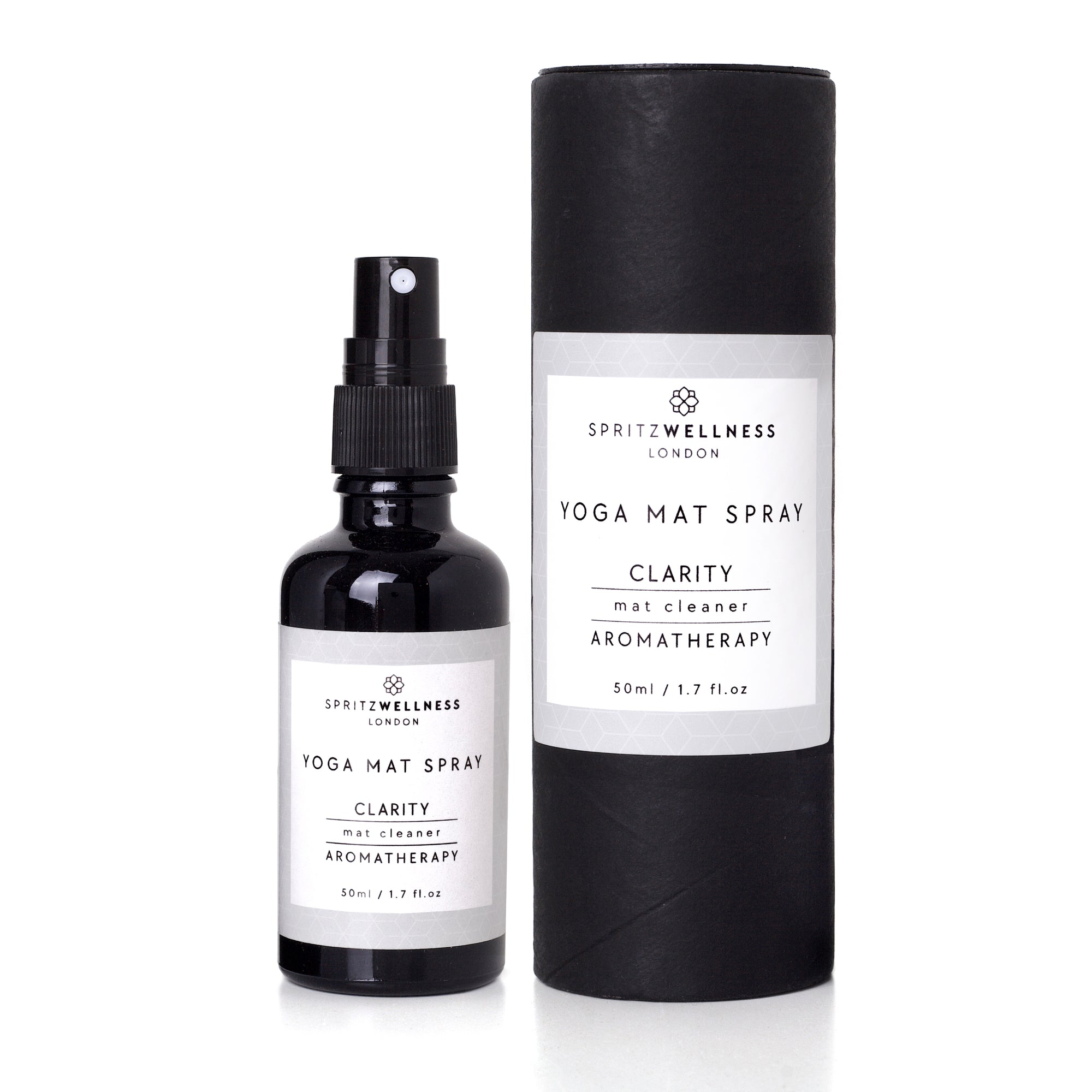 Spritz Wellness London yoga mat spray bottle and cylindrical container on a white background