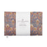The image displays a rectangular aromatherapy wheat bag with a liberty print in Hera Brown color, predominantly featuring shades of blue and brown.